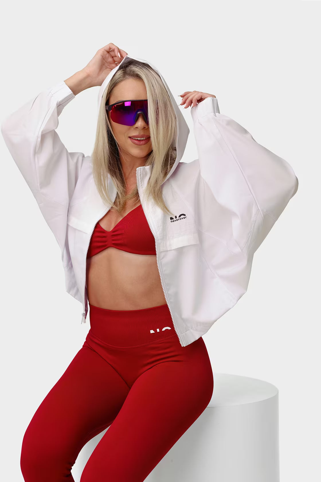 Corina in the red set and the white NOVO windbreaker — the new season
